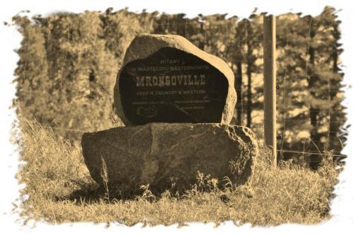 a black and white photo of a rock and a monument at Pokoje Miasteczko Mrongoville in Mrągowo