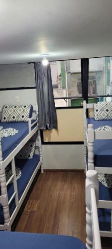 a room with two bunk beds on a boat at Hostel Princess Copacabana in Rio de Janeiro
