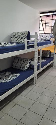 two bunk beds in a dorm room at Hostel Princess Copacabana in Rio de Janeiro