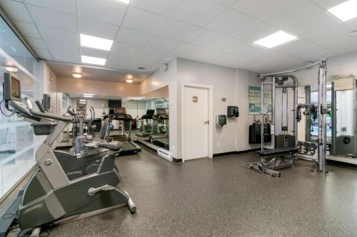 a gym with treadmills and machines in a room at Best Western Premier Aberdeen Kamloops in Kamloops