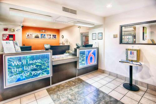 a fast food restaurant with a counter with a sign at Motel 6-Mammoth Lakes, CA in Mammoth Lakes