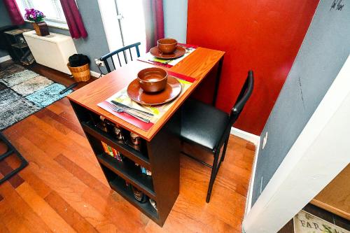 a small table with two plates and bowls on it at Modern Designed DTWN Condo with a 99 percent Walk Score in Atlanta