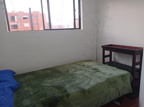En eller flere senge i et værelse på Alojamiento Aurora de Acacias