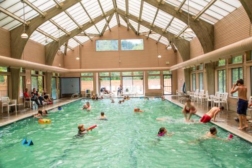 a group of people in a swimming pool at Mount Hood Village Zoe Tiny House 9 in Welches