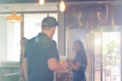 a man and a woman standing in a room at mt. inn(マウントイン） in Nihommatsu