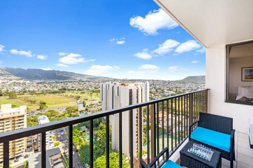 a balcony with a view of a city at Stylish Unit Near Waikiki Beach with Free Parking! in Honolulu