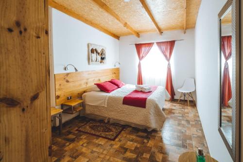 a bedroom with a bed and a window at Peumayen Atacama cabaña&Hostal in San Pedro de Atacama