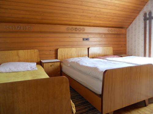 Postel nebo postele na pokoji v ubytování Ferienwohnungen/Holiday Apartments Lederer
