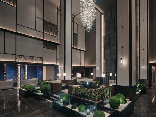 a rendering of the lobby of a planned hotel at HUALUXE Kunshan Huaqiao by IHG - F1 Racing Preferred Hotel in Kunshan