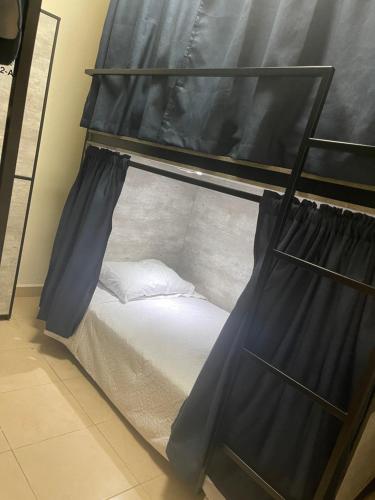Ein Bett oder Betten in einem Zimmer der Unterkunft HOSTAL XAO