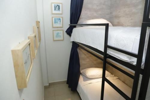 Ein Bett oder Betten in einem Zimmer der Unterkunft HOSTAL XAO