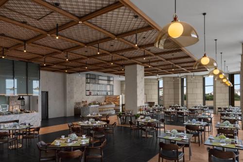 a large dining room with tables and chairs at Crowne Plaza Vinh Yen City Centre by IHG in Yen