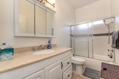 a bathroom with a sink and a toilet and a shower at Comfortable 2BR Spacious Deck! 7 mins to Sacramento Downtown and Midtown in Sacramento