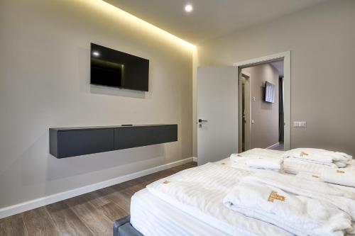 Postel nebo postele na pokoji v ubytování Olimp Hotel