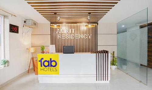 a lobby of a hotel with a reception desk at FabHotel Amrit Grand in Gurgaon