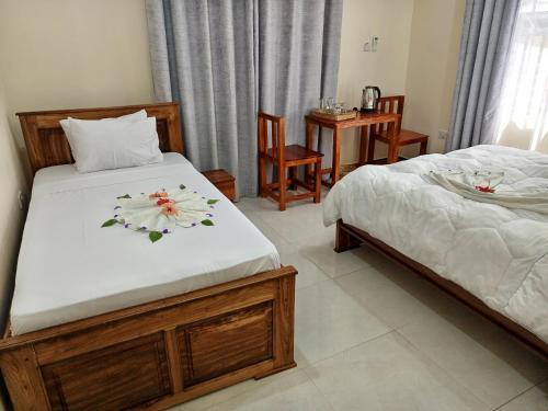 Кровать или кровати в номере Kendwa Cool and Calm Hotel limited