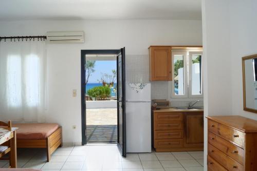 A kitchen or kitchenette at LEANDROS APARTMENTS