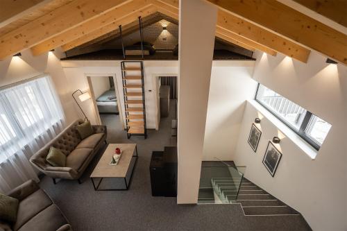 an overhead view of a living room with a couch and a table at Chalet Malino - Apartments in Ružomberok