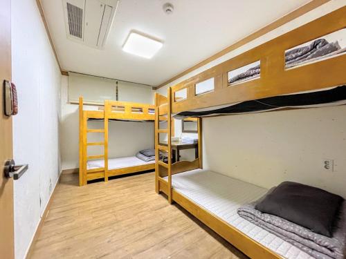 Postel nebo postele na pokoji v ubytování Cocoa Guesthouse