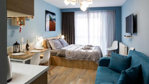 Postel nebo postele na pokoji v ubytování New Gudauri Loft 2 Apartments