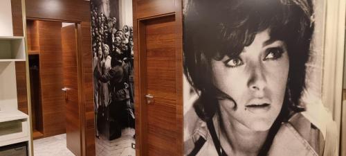 a room with a picture of a woman on a door at Best Western Premier BHR Treviso Hotel in Quinto di Treviso