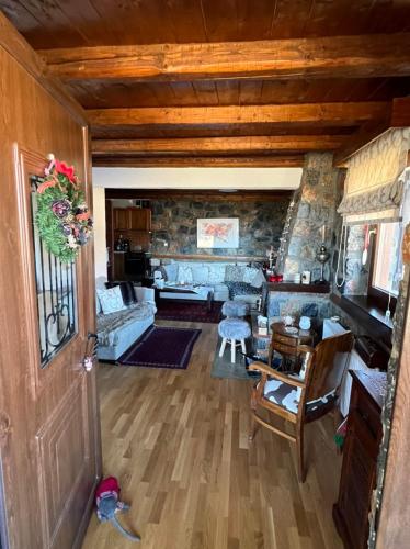 an overhead view of a living room with a couch at Mountain house in Palaios Agios Athanasios