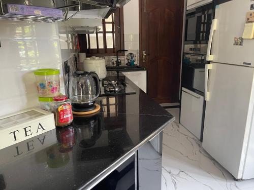 a kitchen with a counter with a blender on it at New View Hikkaduwa in Hikkaduwa
