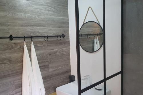 a bathroom with a mirror and a sink at Zimmer mit kleiner Dachterrasse / App. WALD byTILLY in Velden am Wörthersee
