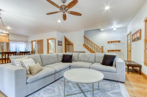 a living room with a couch and a table at Oak Street Retreat in Sisters