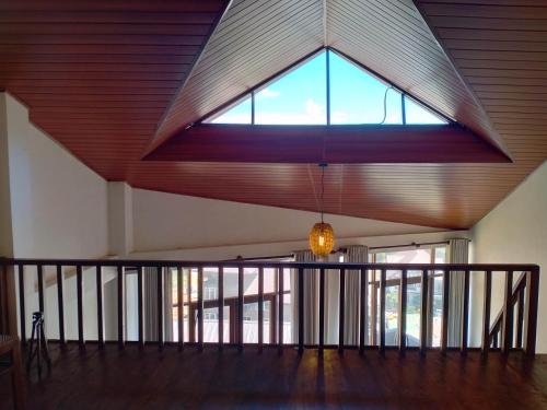 a large window in the ceiling of a room at MANUDI Glenfallsedge Rest in Nuwara Eliya