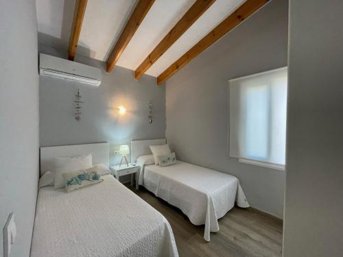 Postel nebo postele na pokoji v ubytování Villa Sol del Sur 10