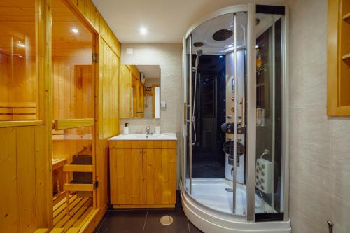 a bathroom with a shower and a sink at OPORTO GUEST Oliveira House in Porto