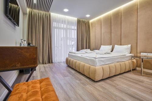 Postel nebo postele na pokoji v ubytování Olimp Hotel
