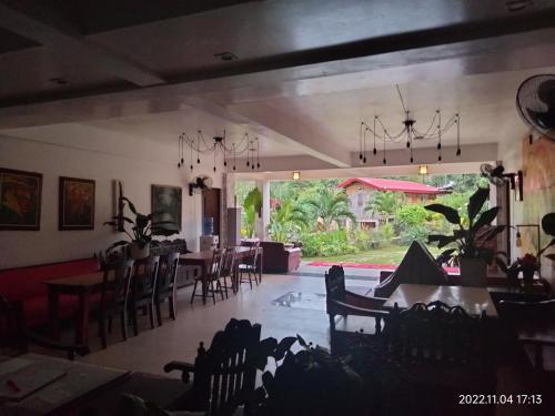 a dining room with a dining table and chairs at Casa de Robles Tanay Rizal in Tanay