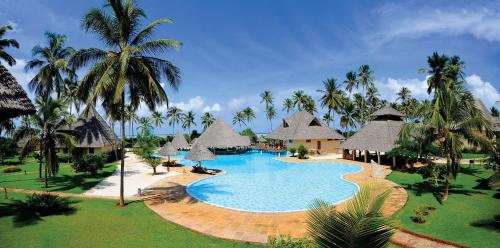 an aerial view of a resort with a swimming pool at Neptune Pwani Beach Resort & Spa Zanzibar - All Inclusive in Pwani Mchangani