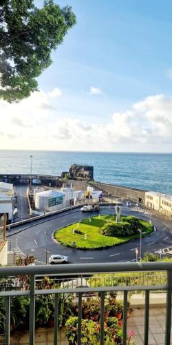 a view of a city with a street and the ocean at Ocean Pearl Apartment M in Funchal