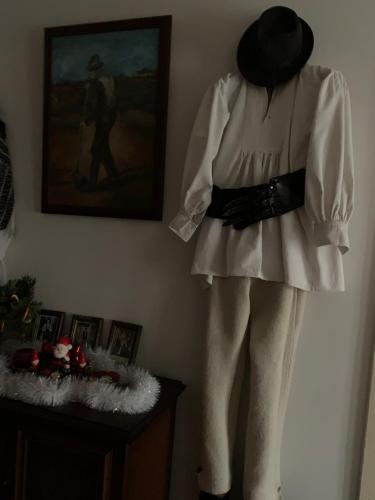 a mannequin wearing a white dress and a hat at CASA LUI MOȘU in Alba Iulia