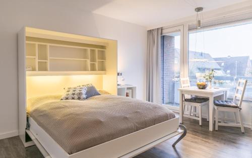 Postel nebo postele na pokoji v ubytování "Nordseekante" Nordseekante, Whg 365