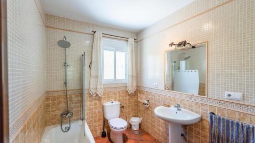 a bathroom with a toilet a sink and a shower at Chalet Algar by Ruralidays in Algar