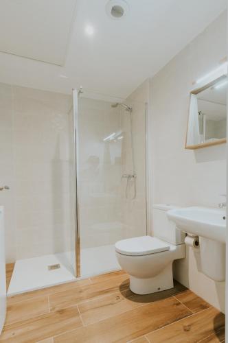 a bathroom with a shower and a toilet and a sink at Natural Stay Apartamentos PassivHaus in Logroño