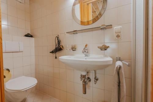 a bathroom with a sink and a toilet at Haus Wilma in Schruns