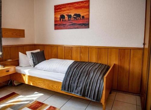 a bed in a room with at Hotel Zur Aue in Wesel