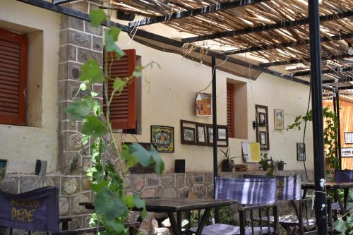 a patio with tables and chairs in a building at La Enramada in Amaichá del Valle