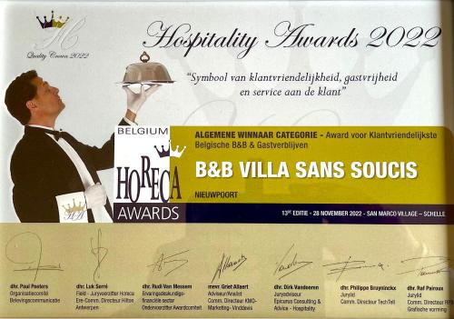 a poster for a restaurant with a man holding a plate at B&B Villa Sans Soucis in Nieuwpoort
