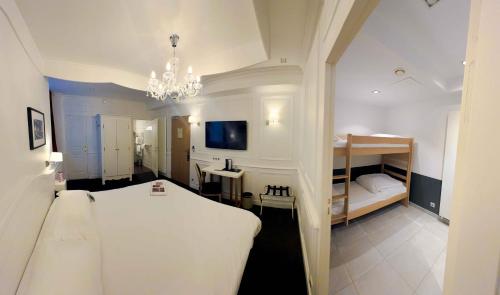 a bedroom with a white bed and a bunk room at Le Magic Hall in Rennes
