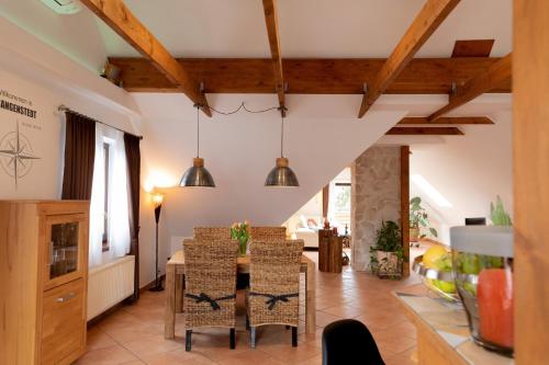 a dining room with a table and chairs at Ferienwohnung Aurora in Winsen Luhe