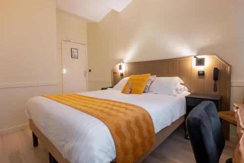 Logis Hôtel Rêve de Sableにあるベッド
