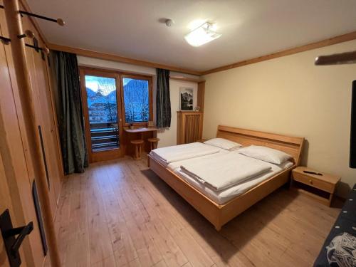 Posteľ alebo postele v izbe v ubytovaní Haus Alpenruhe