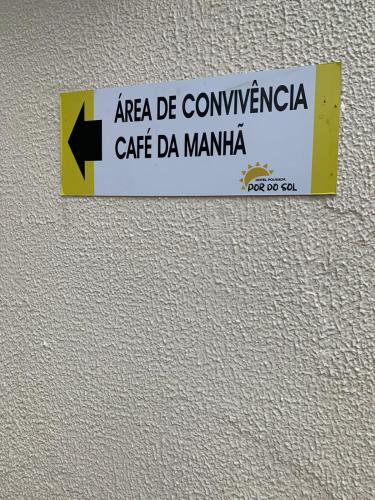 a sign on the wall of a building at HOTEL POUSADA POR DO SOL in Pato Branco