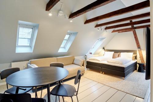 a living room with a couch and a table at Perfect Apartment for Friends & Families in central Copenhagen in Copenhagen